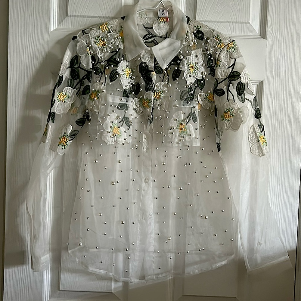 This chic blouse is fully embroidered, you can dress up & dress down